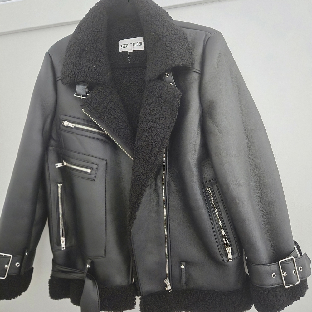Faux leather jacket is made to look like a sheep.